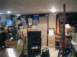 boxes and junk piled in a garage
